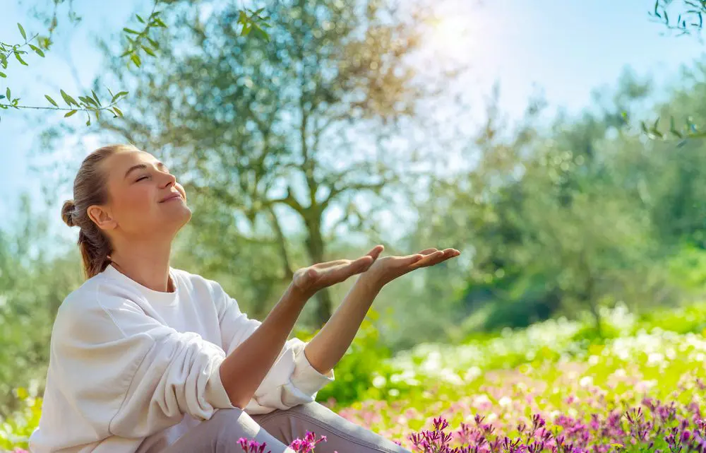 Woman relaxing outdoors in a calm setting